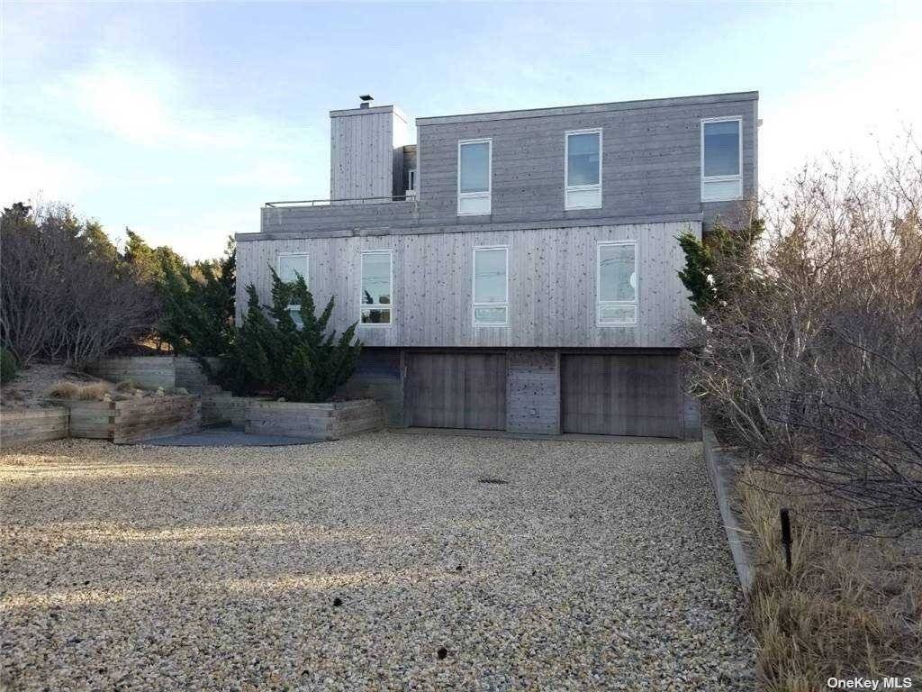 Rent this immaculate modern oceanfront home this August.
