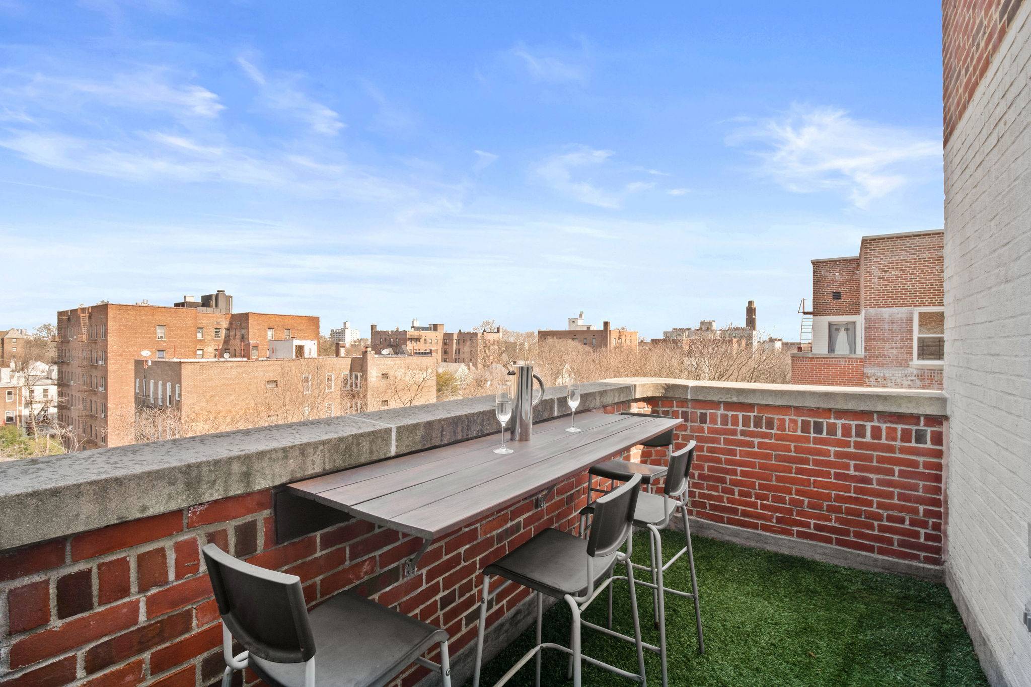 Top floor corner home with a sunny private terrace with views for days !