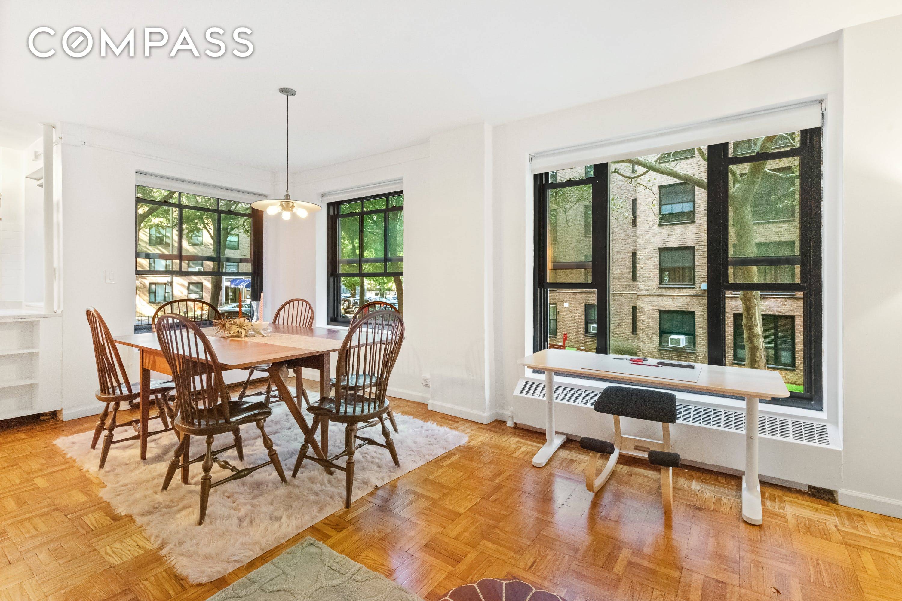 This extra large one bedroom with dining room has double exposures and charming courtyard views.