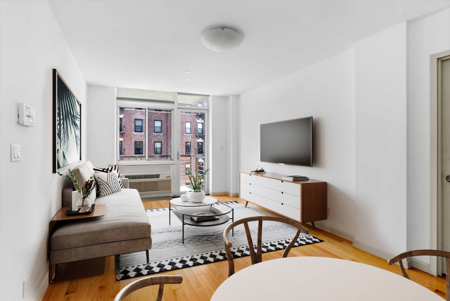 Enjoy endless western sunlight and great storage space in this expansive split two bedroom, two bathroom home in a modern East Harlem condominium building.