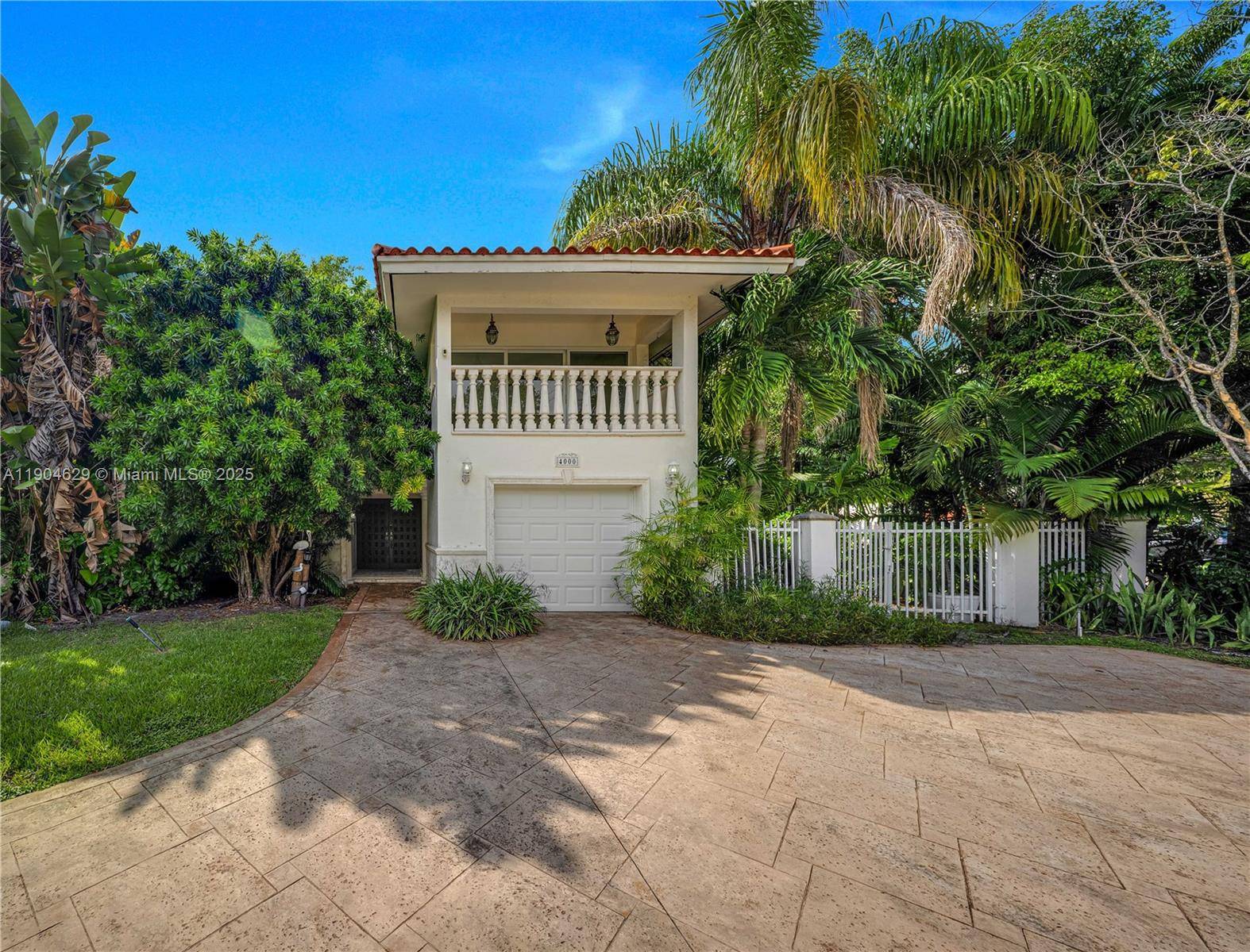 Bright amp ; spacious 2 story home on a desirable corner lot in the heart of Coral Gables, located on prestigious Alhambra Circle.