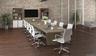Office area featuring brick wall, wood finished floors, and built in features