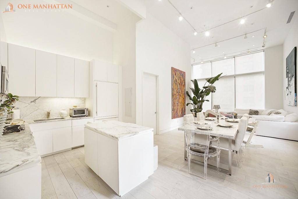 CONDO conversion dramatic oversized living room greets you as you enter this 3, 534 square foot 3 bed 3 and a half bath duplex with 1000 sf Private roof deck.