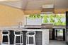 View of patio / terrace featuring wine cooler and an outdoor kitchen