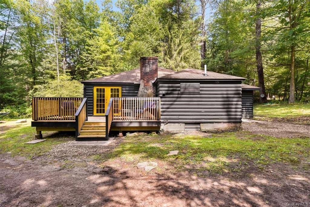 Nearly 40 private acres nestles this newly renovated rustic log cabin in the quaint hamlet of Narrowsburg.