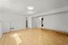 View of the family room. Laundry closet is in the center and full bath beyond that. Office is on the right.