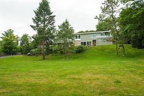 Spend summer in Westport in this never before offered stunning, custom, mid century home just steps from Compo Beach.