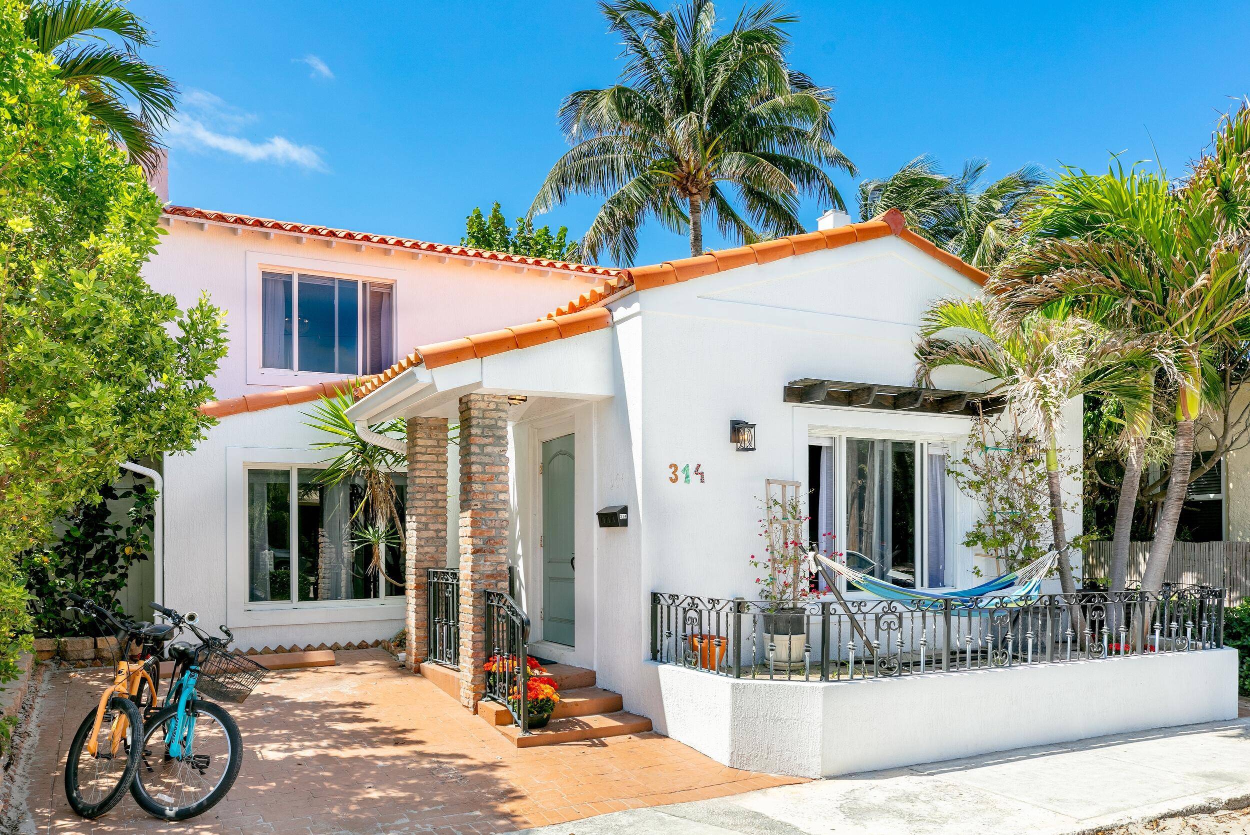 Paradise Awaits ! Unrivaled fully renovated Hollywood home with classic charm just steps from the pristine beach !