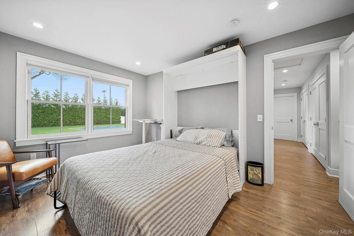 Bedroom featuring dark wood-type flooring and recessed lighting