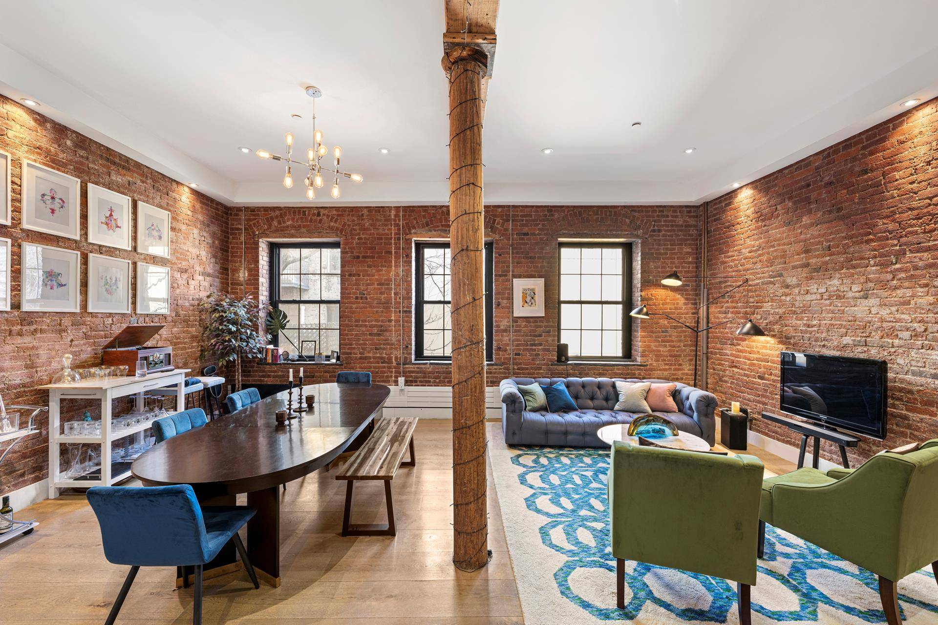 Mint condition historic condominium loft in the historic Seaport with high ceilings, wide plank hardwood floors, exposed brick, hewn wood beams and timber columns.