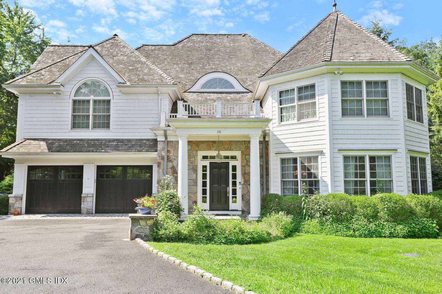 This striking shingle style open floor plan home is just seconds to town.