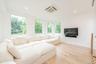 Living room featuring cooling unit, light wood-type flooring, and recessed lighting