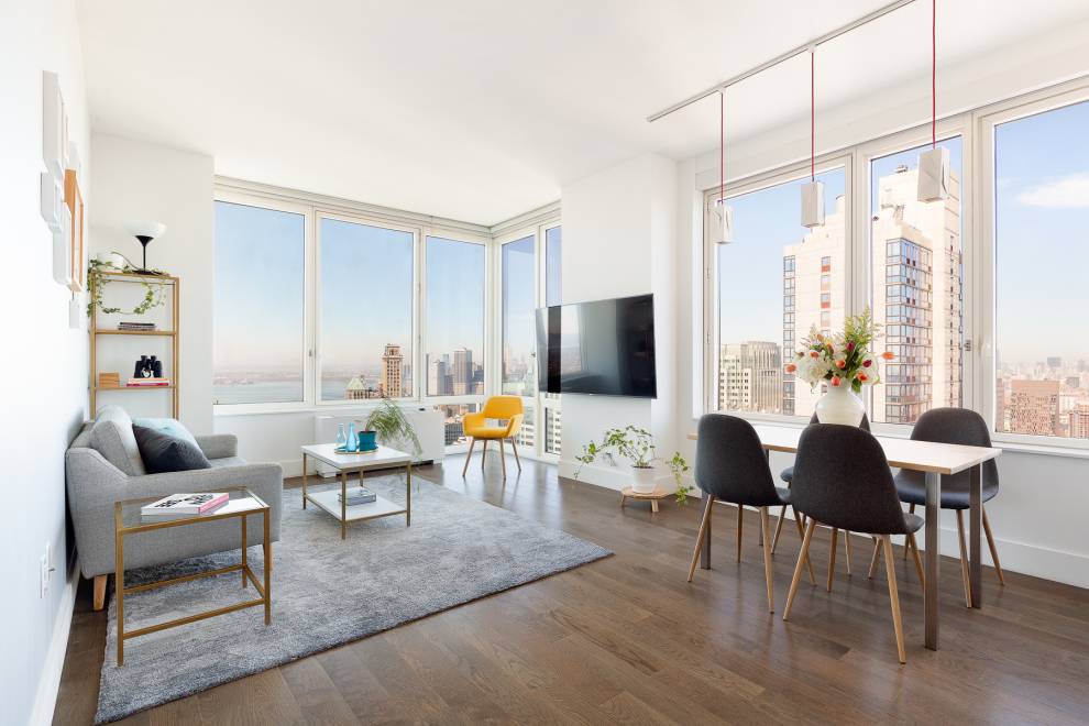 Airy light filled home featuring walls of windows with unparalleled western and northern views of Manhattan, East River, Hudson Bay, Empire State Building, The Freedom Tower, Statue of Liberty and ...