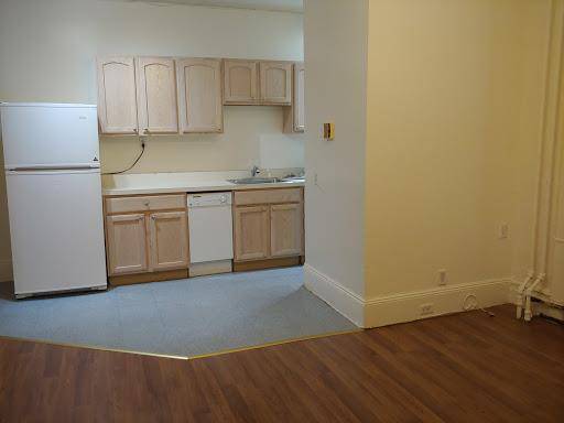 Third floor, back facing unit in an elevator building with laundry on site.