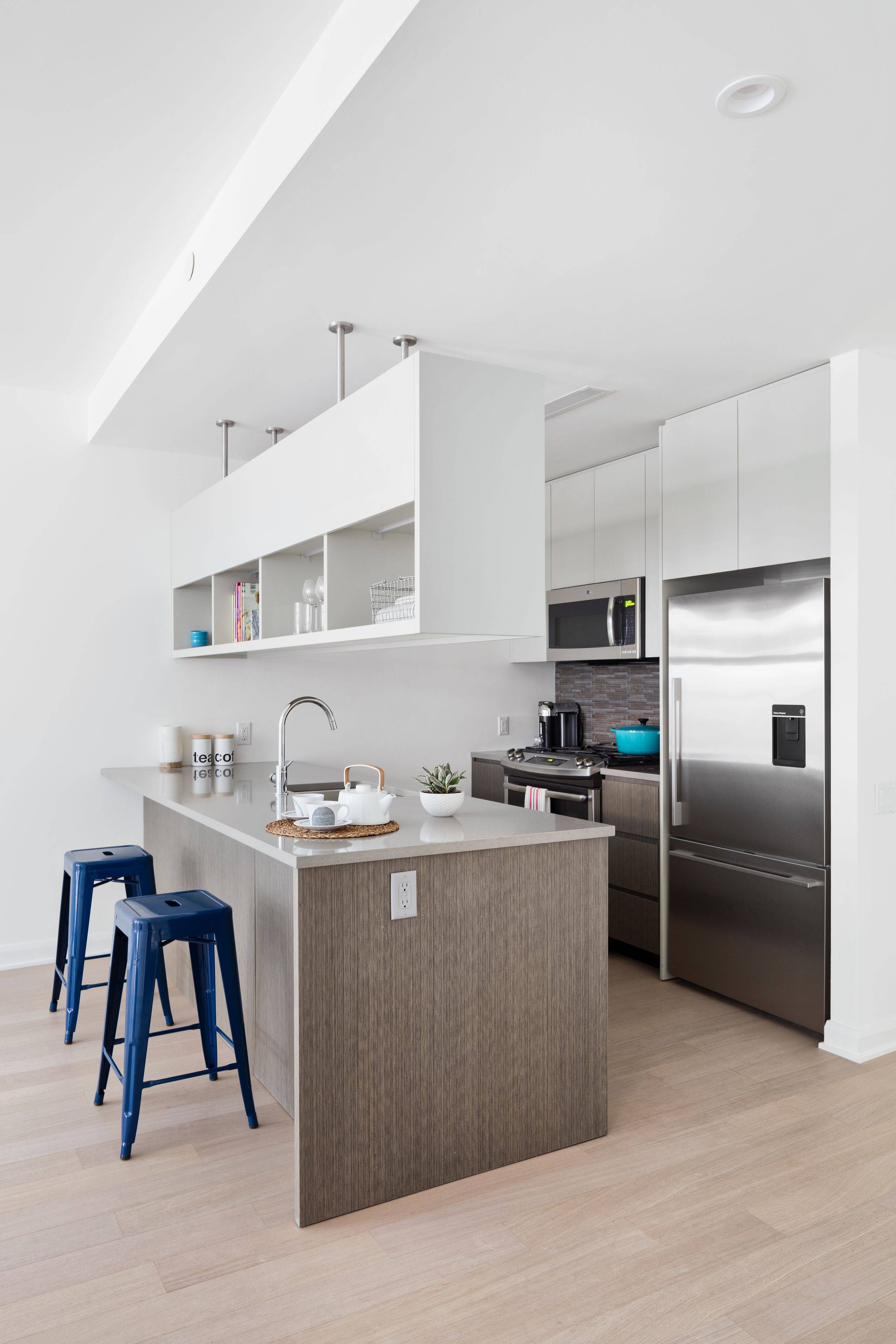 Perfect one bedroom with dramatic floor to ceiling windows and a gourmet kitchen with stainless steel appliances, quartz countertops and eating bar.