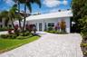 The brick paver circular driveway allows for plenty of parking