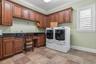 Laundry Room (11x12)Kohler Cast Iron Landry TubMaple Top & Bottom Cabinets & Hanging Racks Granite Counter TopsLarge Storage Closet
