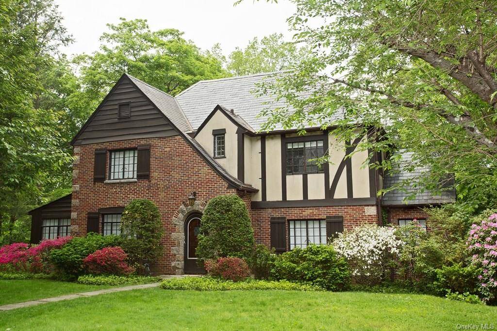 Beautiful spacious brick and stucco Tudor in the heart of the Grange in Greenacres, considered to be one of the finest neighborhoods in Scarsdale, featuring many estate homes.