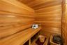 Expansive cedar sauna in the primary suite, designed for a true at-home wellness experience.