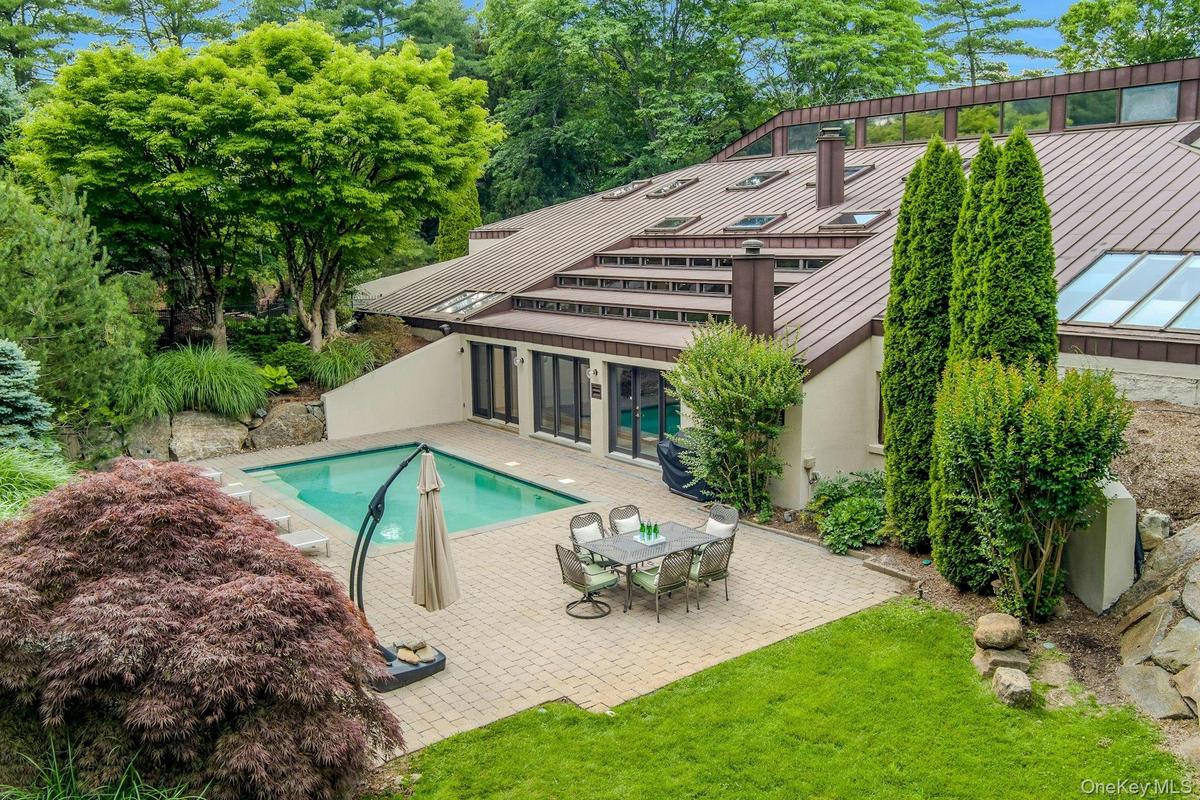 Resort-style outdoor living includes a stunning private pool, creating an idyllic setting for relaxation and entertaining.