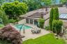 Resort-style outdoor living includes a stunning private pool, creating an idyllic setting for relaxation and entertaining.