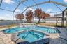 Screened-in pool and spa with beautiful lakeviews