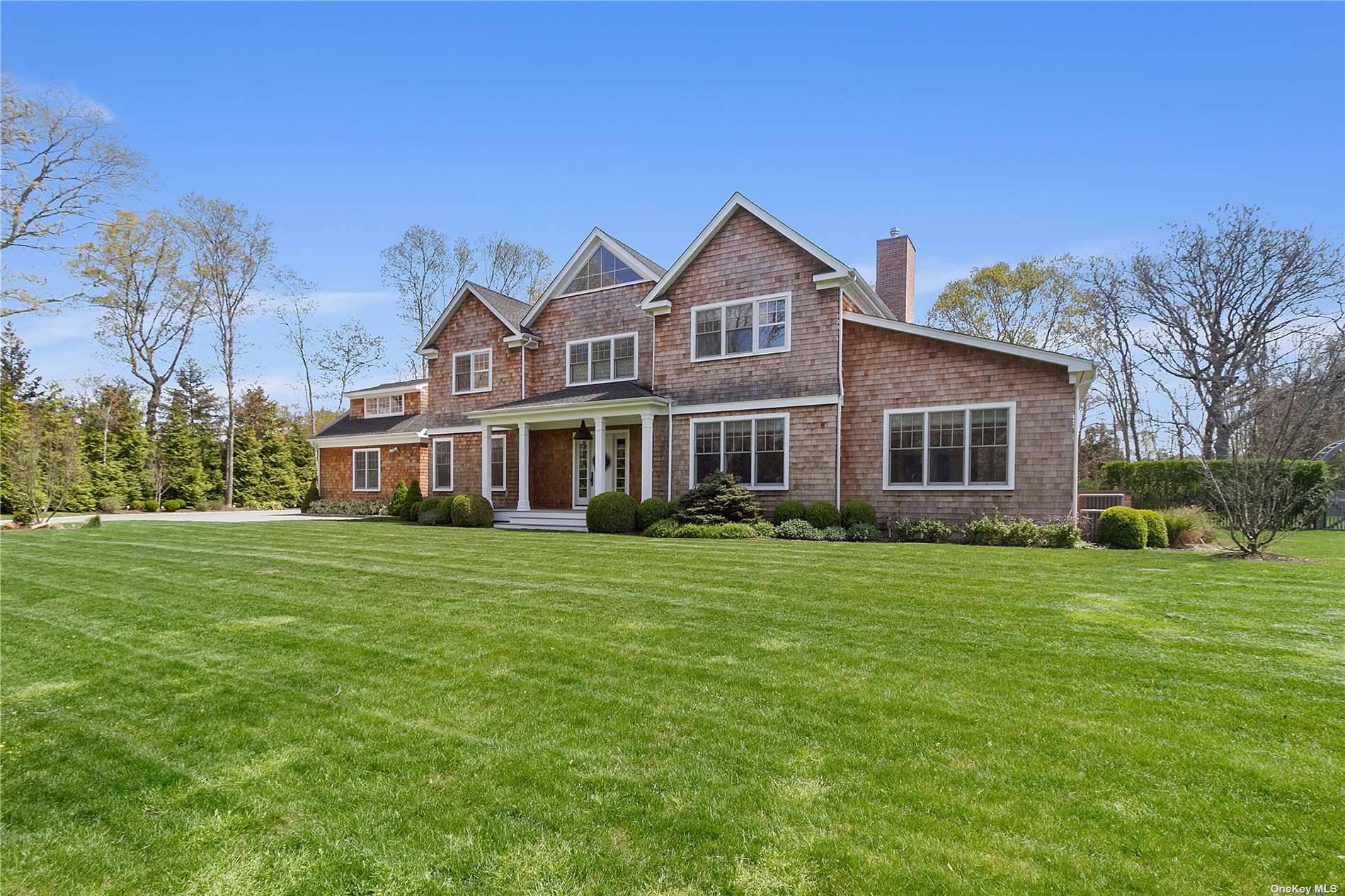 In the heart of Westhampton Beach Village, this spacious two story Postmodern has 5 bedrooms, 6.