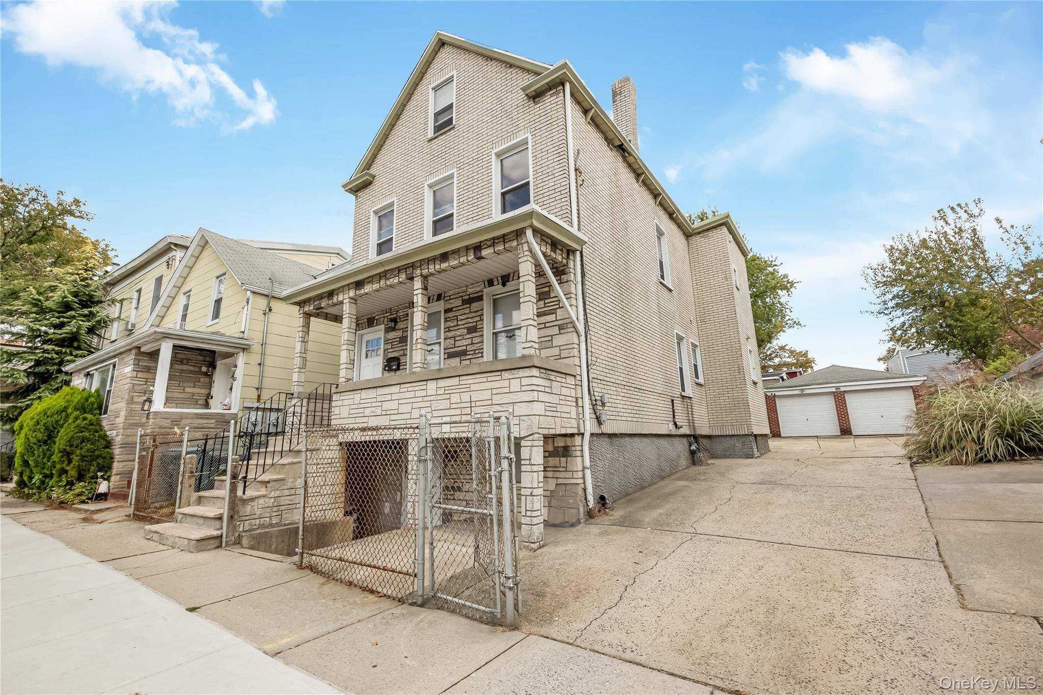 Discover endless potential in this detached two family home sits on a 48X99.