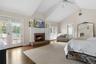 Bedroom featuring wood finished floors, visible vents, access to outside, and french doors