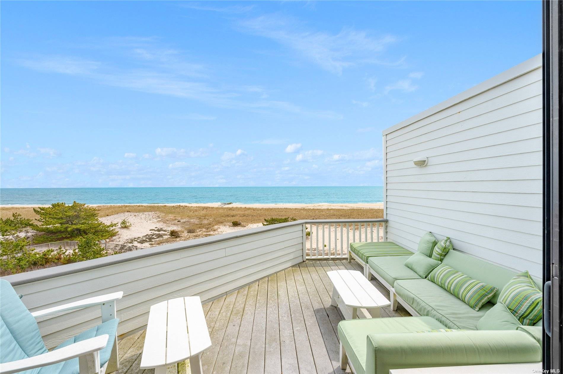 Enjoy expansive views from this oceanfront, top floor, corner unit at the Yardarm Condominiums in Westhampton Beach.