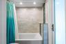 2nd full bath servicing 2nd and 3rd bedroom. Also the cabana bath with access to lanai and backyard