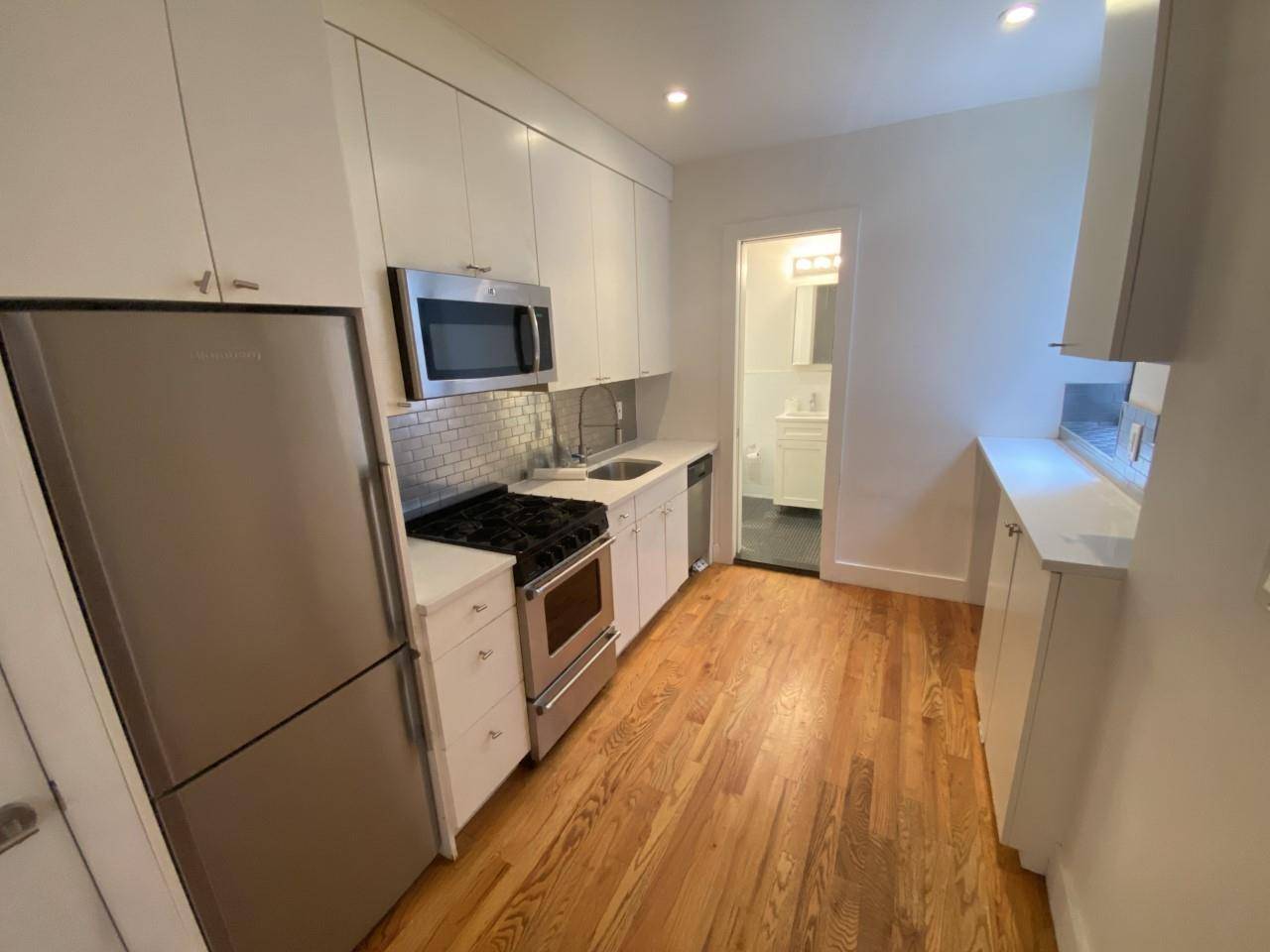 Large Newly Renovated DUPLEX Laundry in unit DishwasherPrime South Park Slope apartment featuring exposed brick, bleached plank floors, custom lacquer white kitchen with stainless steel appliances and a brand new ...