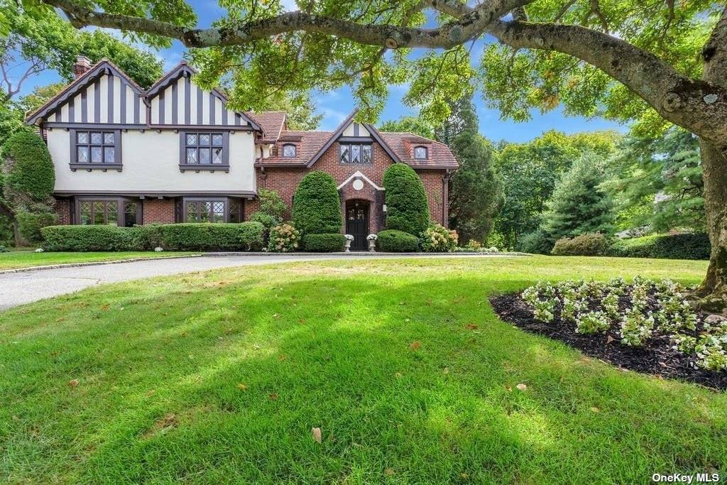 Stunning 5 bedroom English Tudor offers a beautiful welcoming spacious foyer, grand entertaining spaces including a 29x19 formal dining room with gas fireplace, which will be the perfect setting for ...