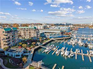 Indulge in luxury living at this exquisite penthouse condo boasting unparalleled waterfront vistas of Long Island Sound and Stamford Harbor.