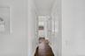 Hallway with dark wood-style flooring