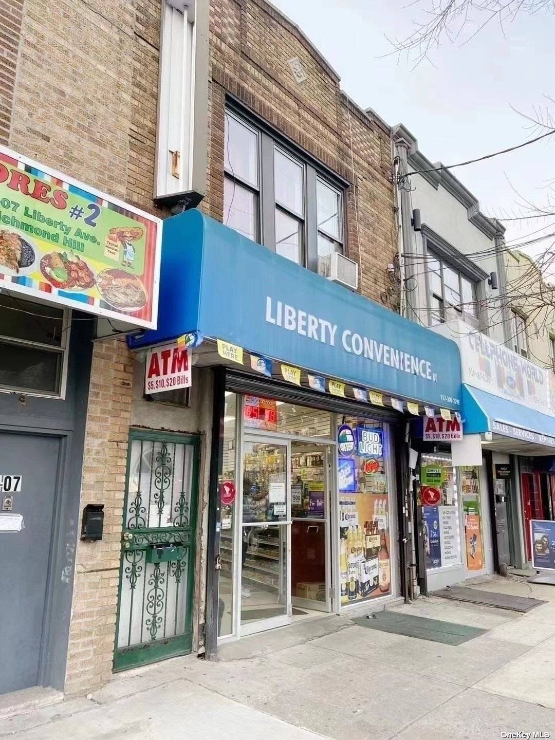 Richmond Hill Two Story Mixed Use Building With Store On Ground Floor And A Newly Renovated 3 Bedroom 2 Bathroom Apartment On the Second Floor.