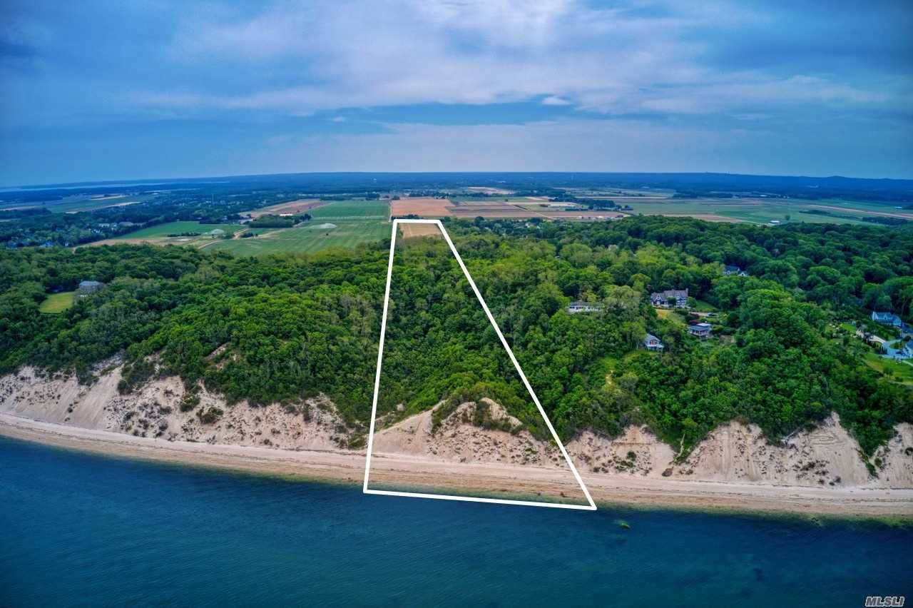 35. 8 acre development rights in tact property with approximately 325' of waterfrontage and beach on the Long Island Sound and 350' road frontage on Sound Avenue presently partially farmed.
