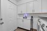 Current owner recently renovated this bright laundry room space. New Washer & Dryer installed, lots of new cabinets, a broom/ironing board closet, a n