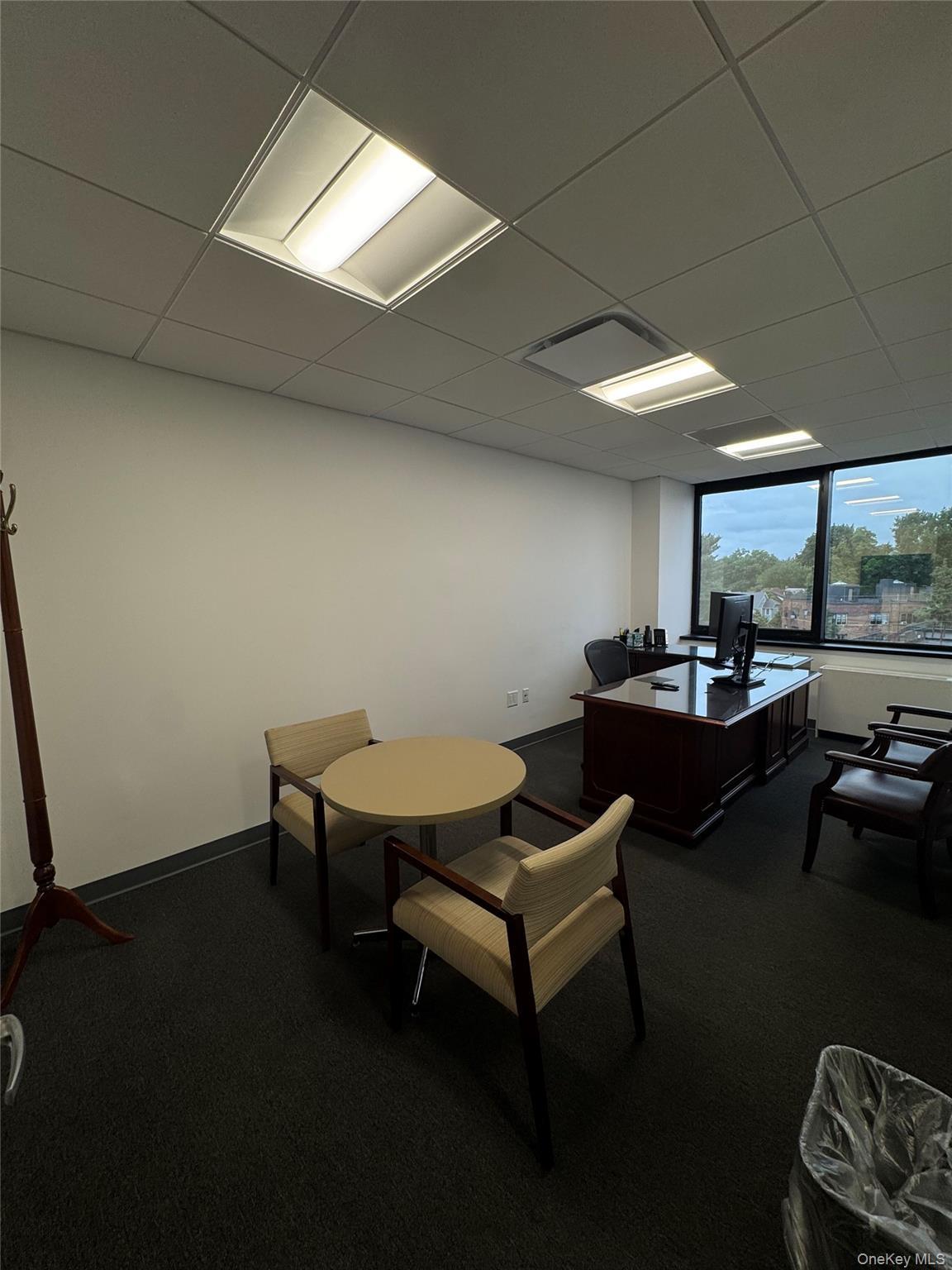 Office space featuring a drop ceiling