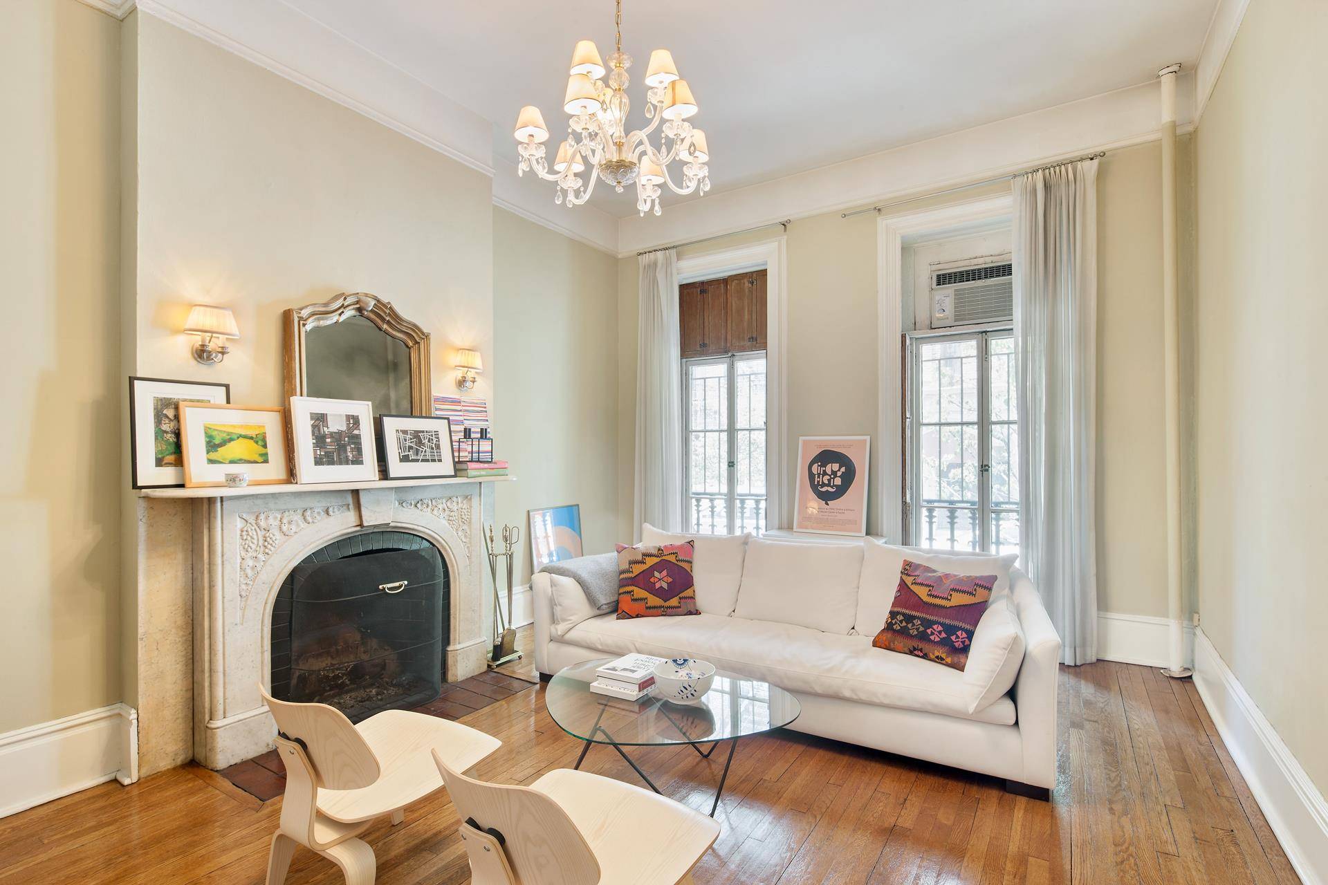 Wonderful west village brownstone parlor floor with private wood deck off of the bedroom, two wood burning fireplaces, high ceilings, hardwood floors, top of the line kitchen, with Subzero fridge, ...