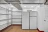Storage Room with Extra Refrigerator in the Basement