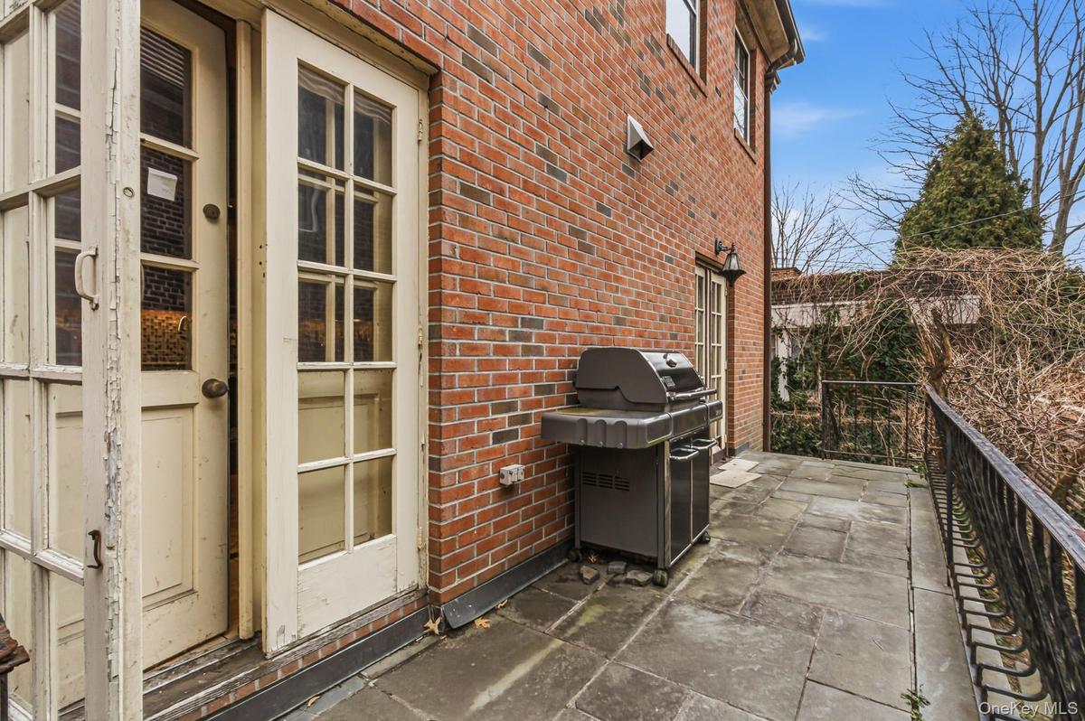 View of patio featuring area for grilling