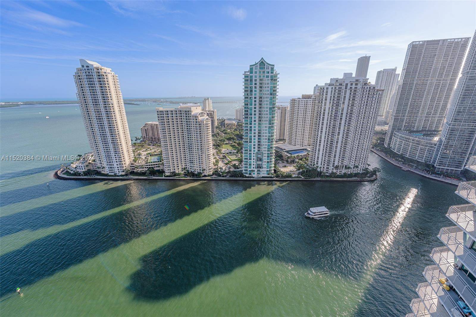 Exquisite 2 bed, 2 bath condo, fully renovated, showcasing breathtaking views of Biscayne Bay and Brickell.