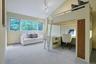A bedroom with ensuite bath creates an ideal retreat with beautiful green views.