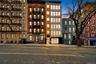 Property at dusk with a view of apartment building / complex