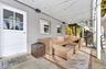 Wooden deck featuring an outdoor hangout area, a patio, and stairway