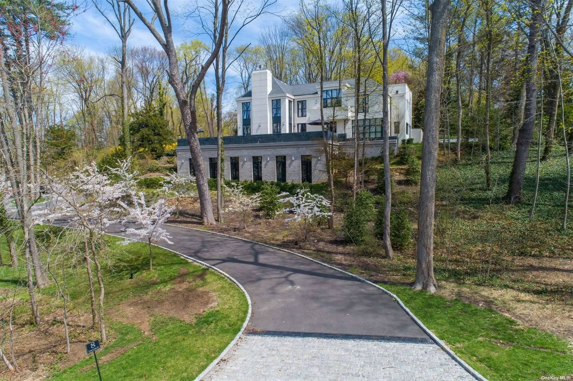 Those with an eye for refinement will be captivated by the exceptional architectural finesse and unparalleled luxury displayed in this hilltop Classic Contemporary Estate.