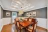 Coffered ceiling with recessed lighting and a decorative chandelier