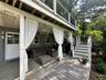 Deck with stairway, outdoor lounge area, and a patio