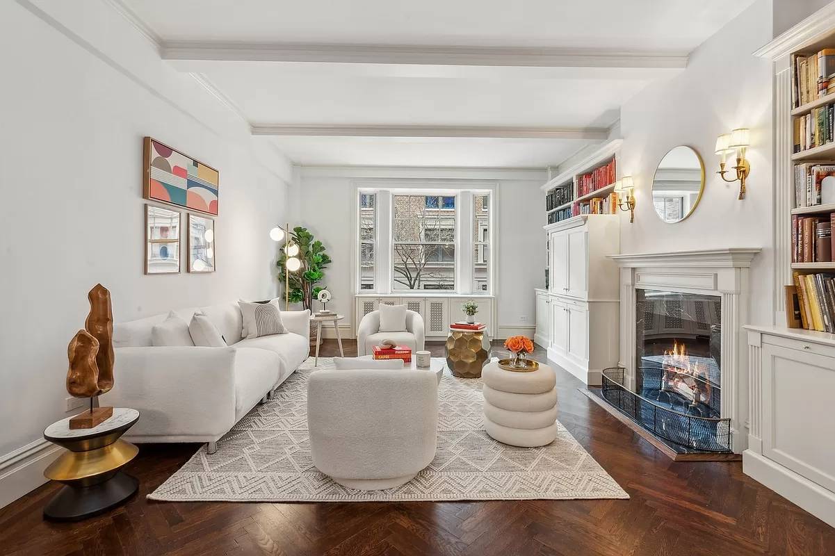 Pre war elegance awaits in this gorgeous 2 bedroom, 2 bathroom co op with a wood burning fireplace, three exposures, and charming details throughout.